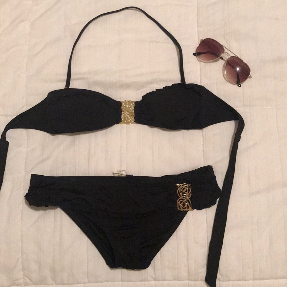 Beautiful ABS black bikini set with gold detail.